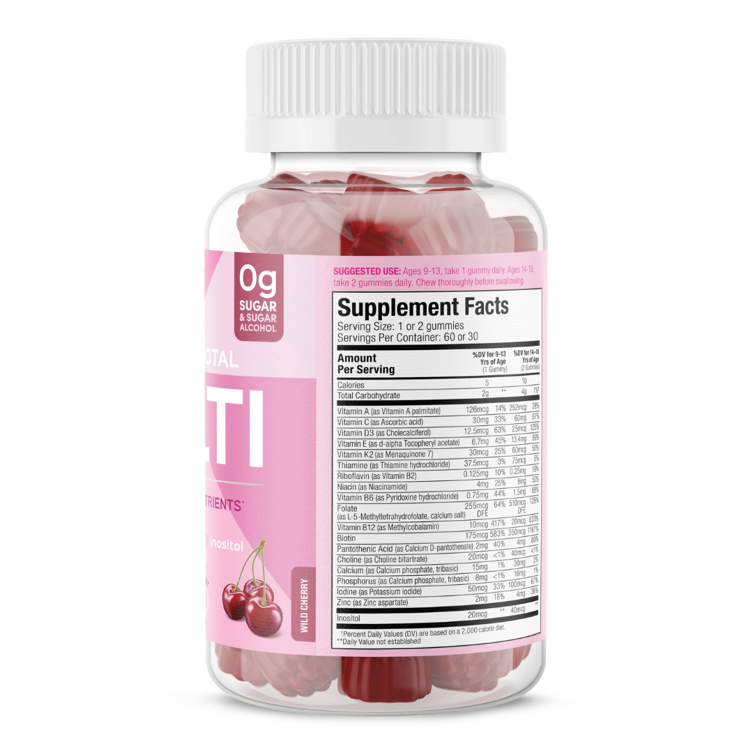 Side view of SUKU Teen Girl Total Multi bottle showing supplement facts. Lists full vitamin and mineral content, including A, C, D3, E, B12, K2, biotin, and zinc. Suitable for vegetarians and free from common allergens.