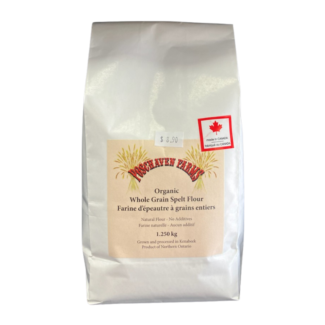 Bag of organic whole grain spelt flour with a label on a white background