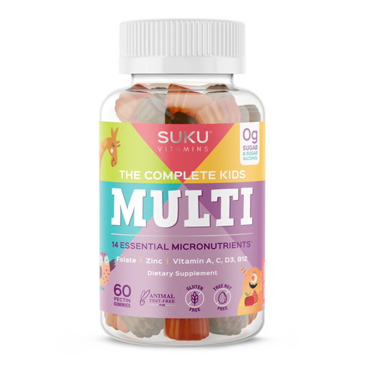 Bottle of SUKU Vitamins "The Complete Kids Multi" with a colorful animal-themed label. Contains 60 tropical-flavored pectin gummies with 14 essential micronutrients including folate, zinc, and vitamins A, C, D3, and B12. Gluten-free, tree nut-free, sugar-free, and animal test-free.