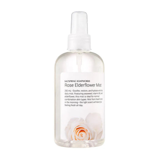 Clear bottle of Rose Elderflower Mist with a white cap on a white background