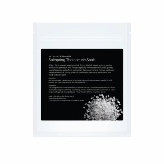 Saltspring Soapworks therapeutic soak packaging with text and a small amount of salt visible.